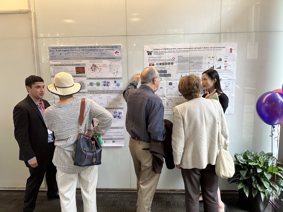 Haroldo Rodriguez, PhD student, and Jung Hyun Lee, PhD, Research Fellow, speak with attendees about their research posters.