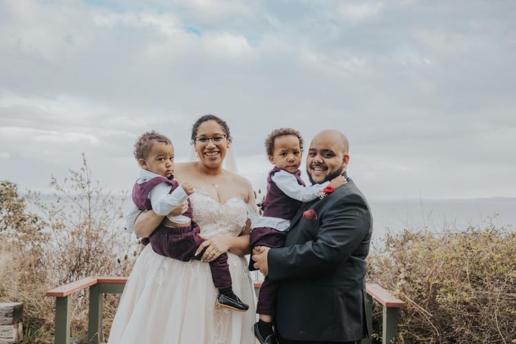 Morgan Keys with her husband Chris and two sons, King and Carter, pictured at their wedding ceremony in Kingston, Wash.