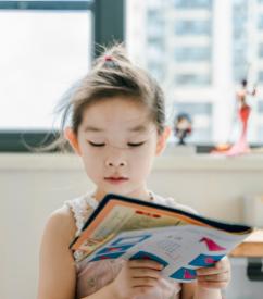 child reading book