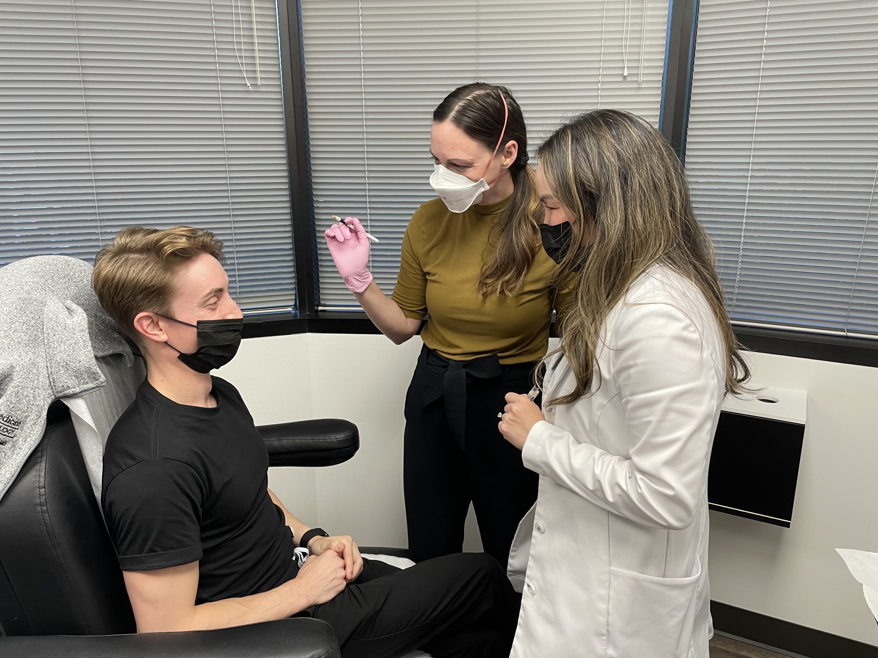 Residents practice cosmetic dermatology procedures with Erica Linnell, MD, of Linnell Dermatology and Aesthetics.
