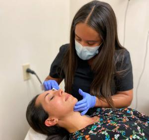 Dr. Ward practicing cosmetic dermatology at Pacific Dermatology & Cosmetic Center.