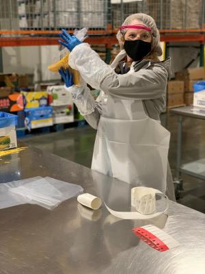 Associate Program Director Dr. Maier posing with her PPE and Spaghetti