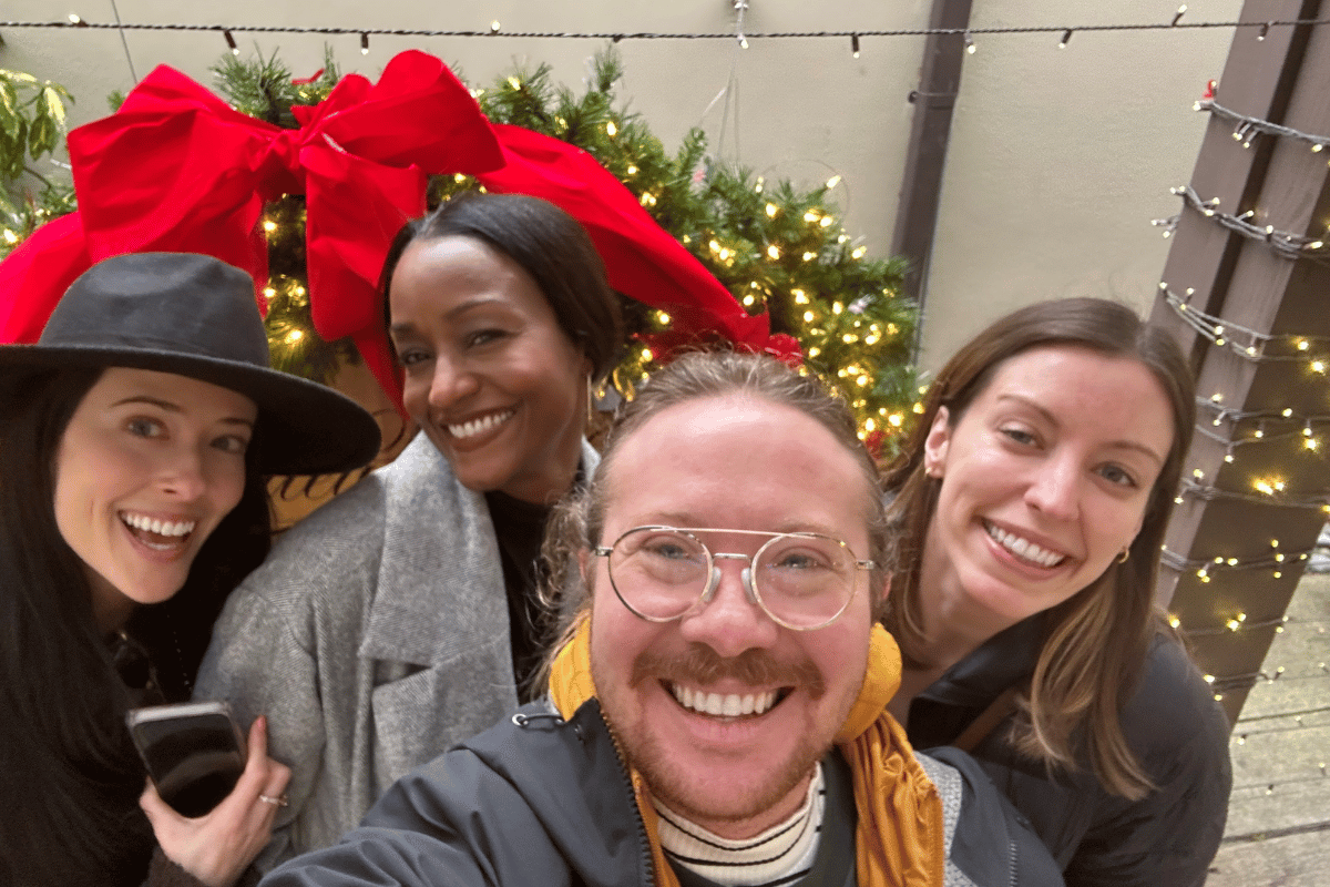 4 residents selfie in front of wreath