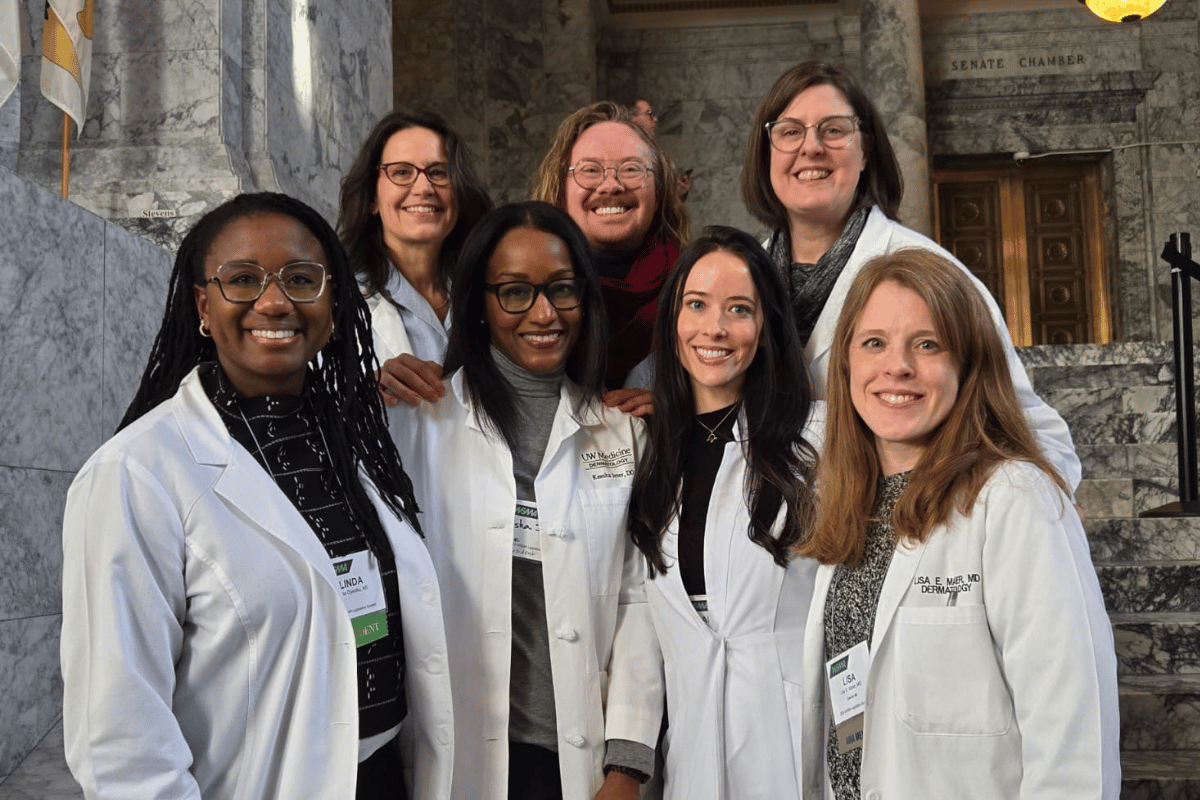 Resident and attendings in white lab coats